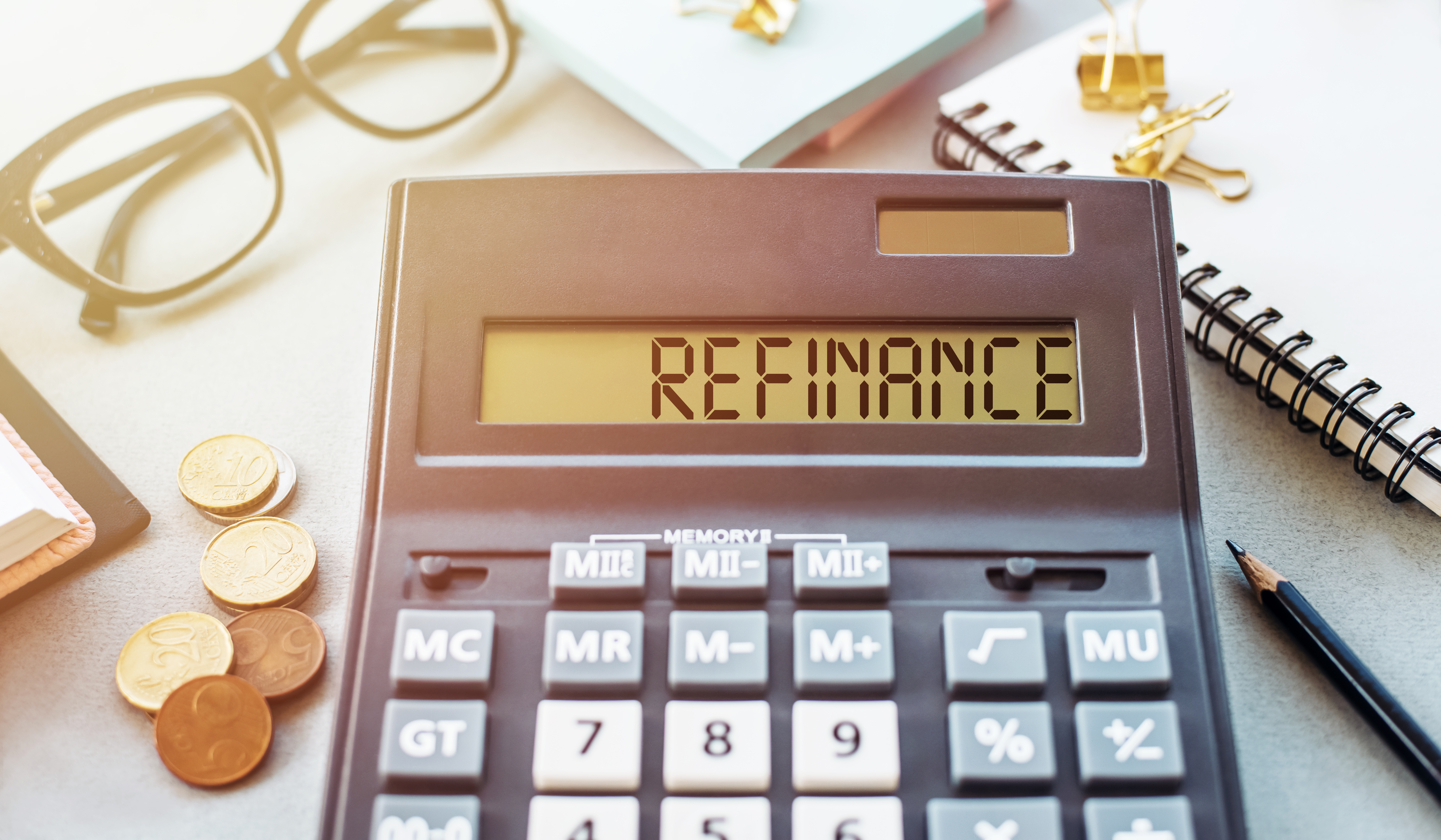 "refinance" typed out on a calculator for heloc. should i use a heloc for a home remodel? find out with PSBT