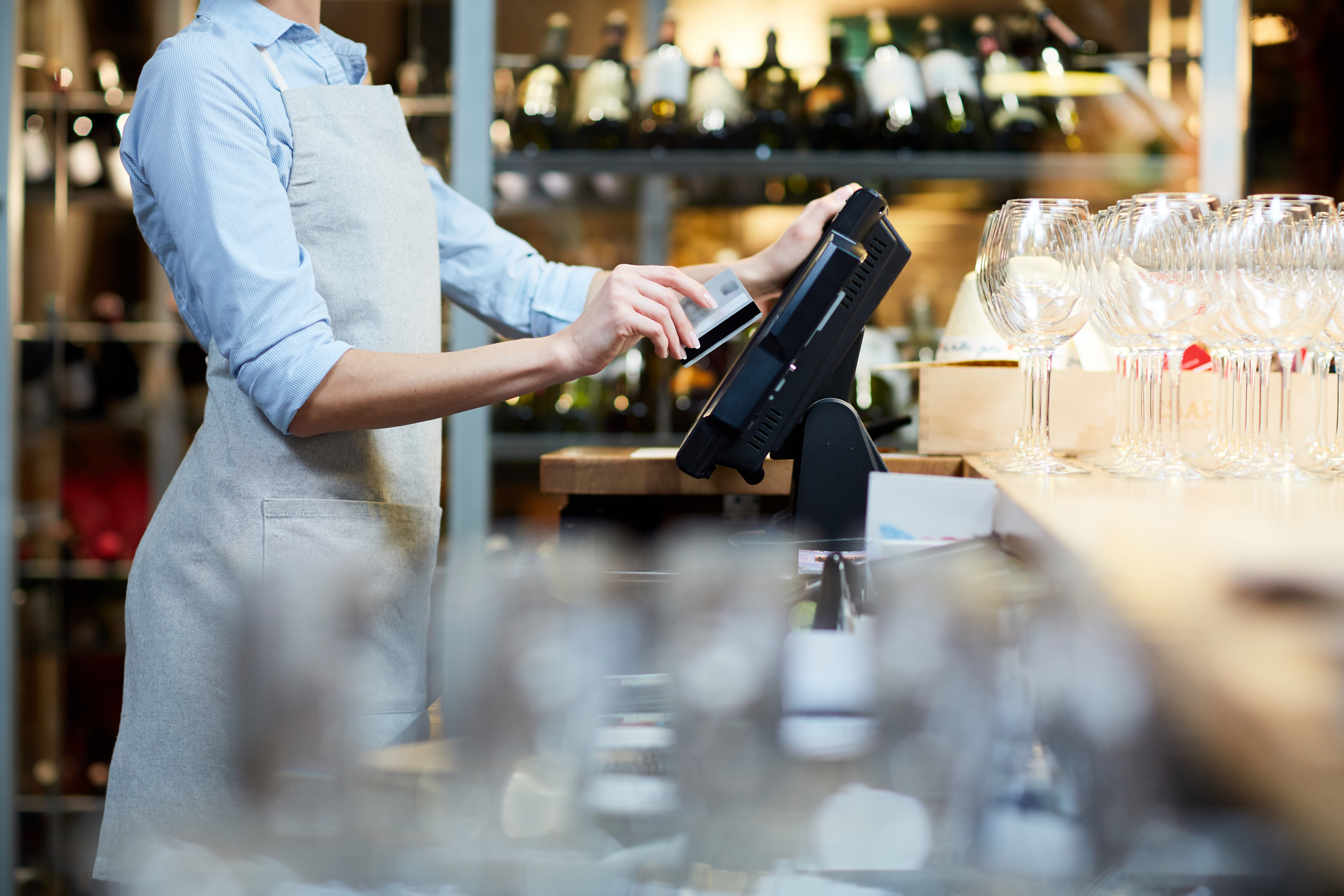 woman using a bank card at a machine